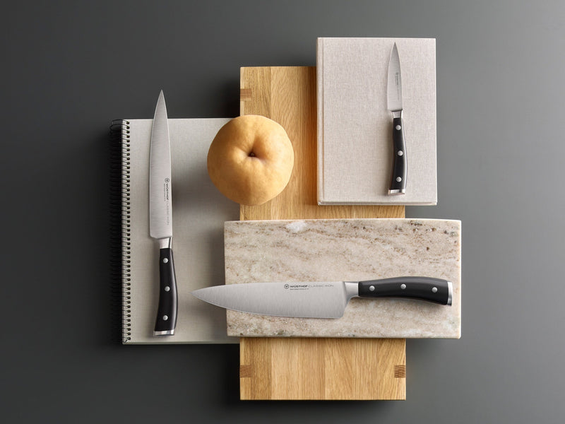 classic ikon knives resting on cutting boards