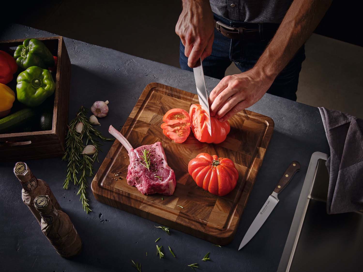 Image of chef slicing a tomatoe with a crafter knife