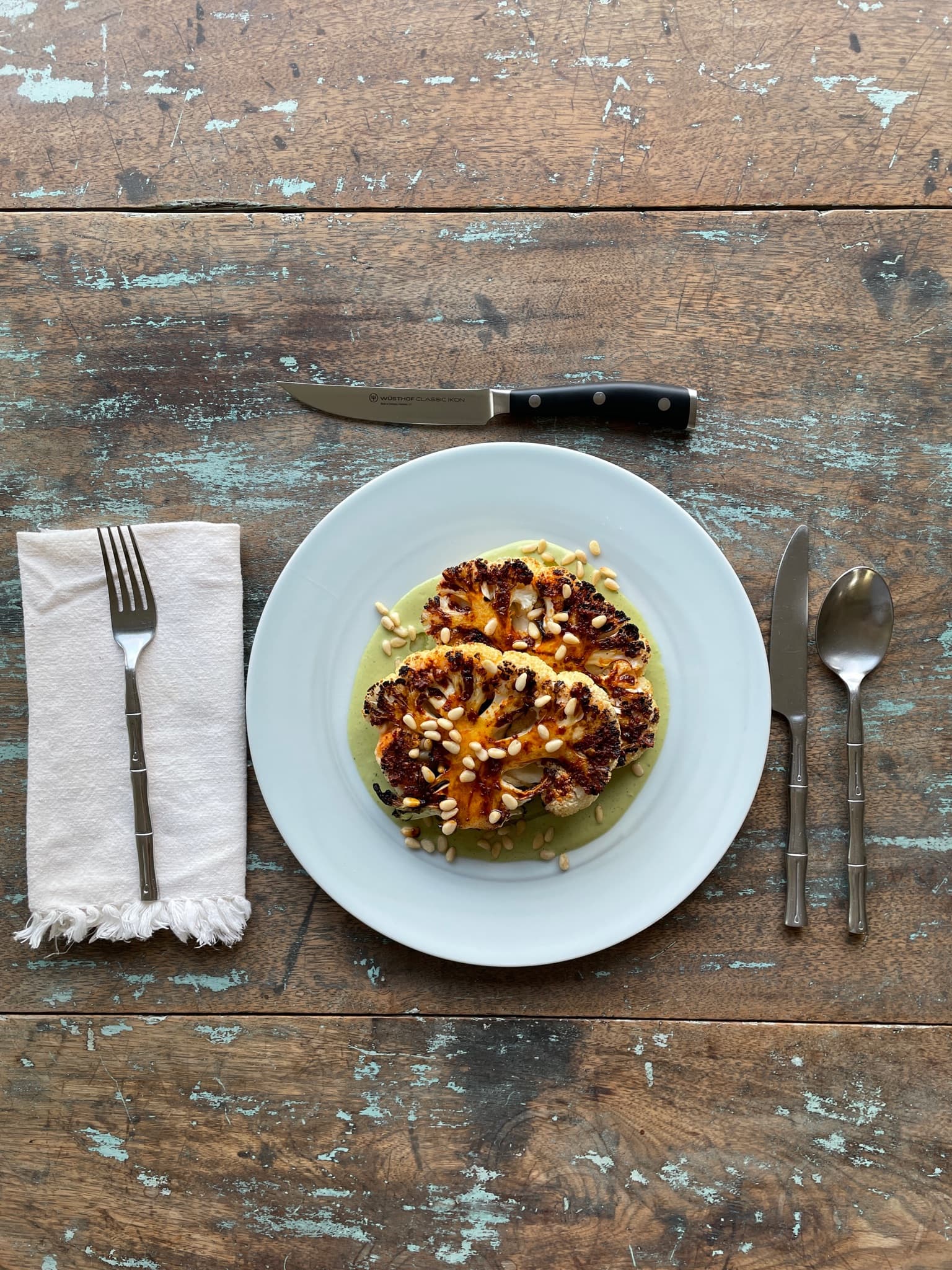 Cauliflower Steaks with Green Tahini and Harissa