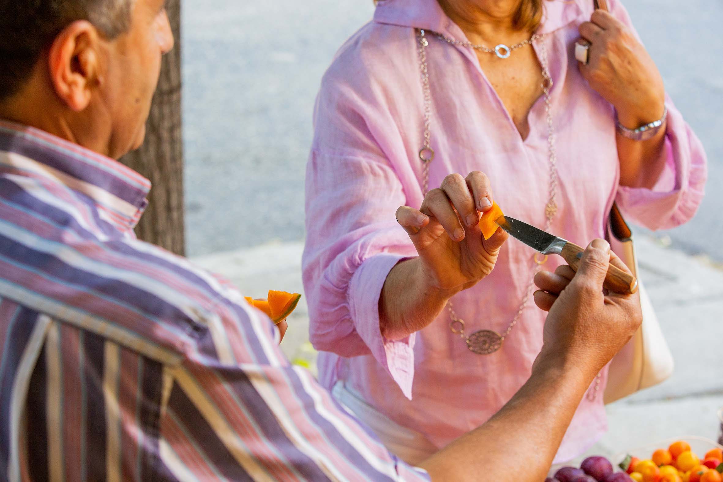 image of nonna picking melon from an amici paring knife