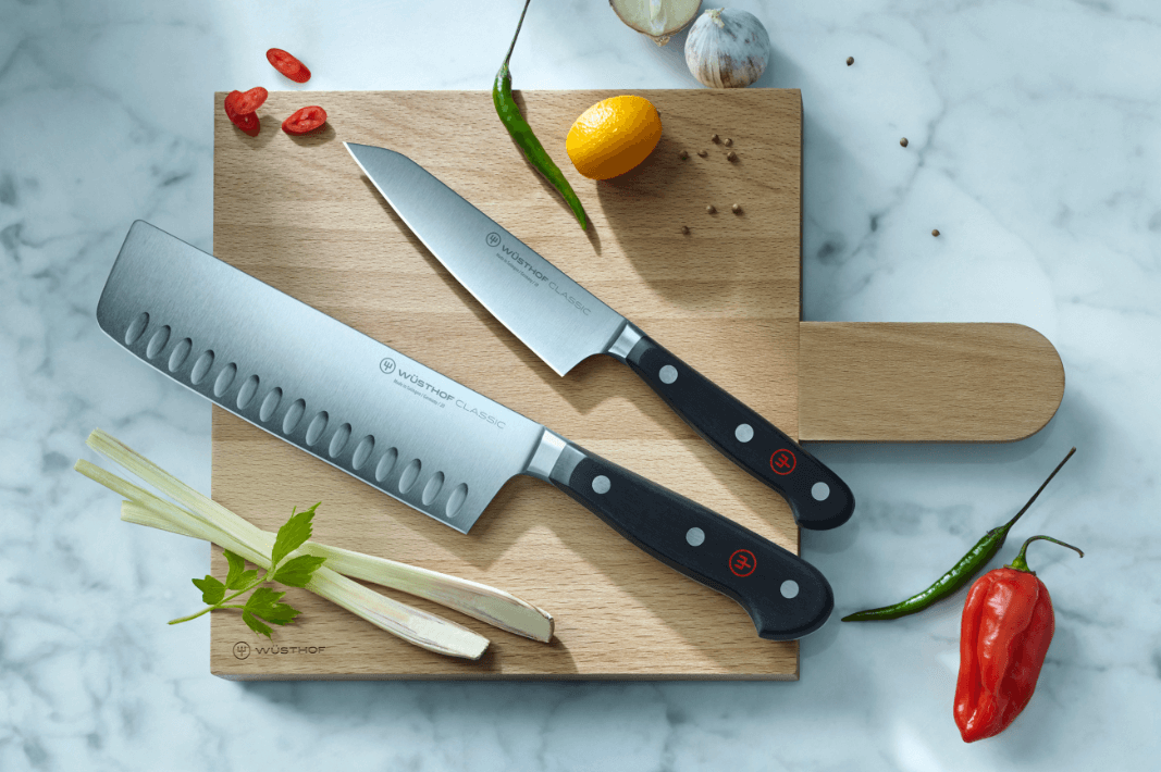 two knives on cutting board