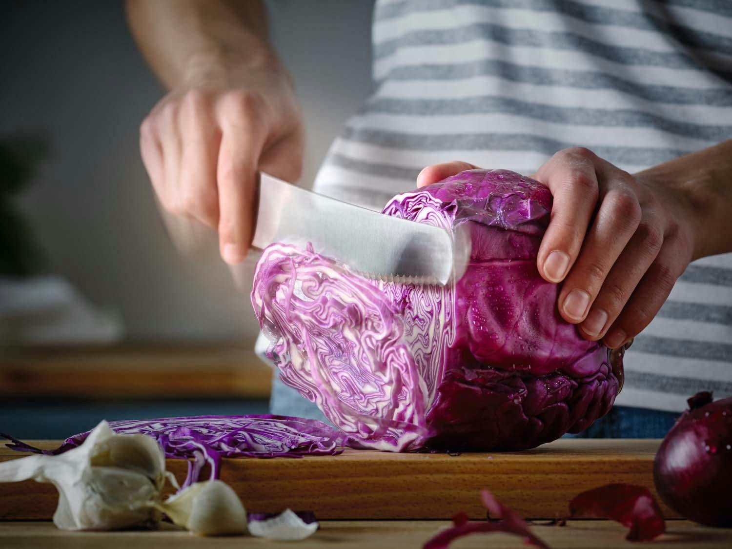 gourmet chef slicing cabbage