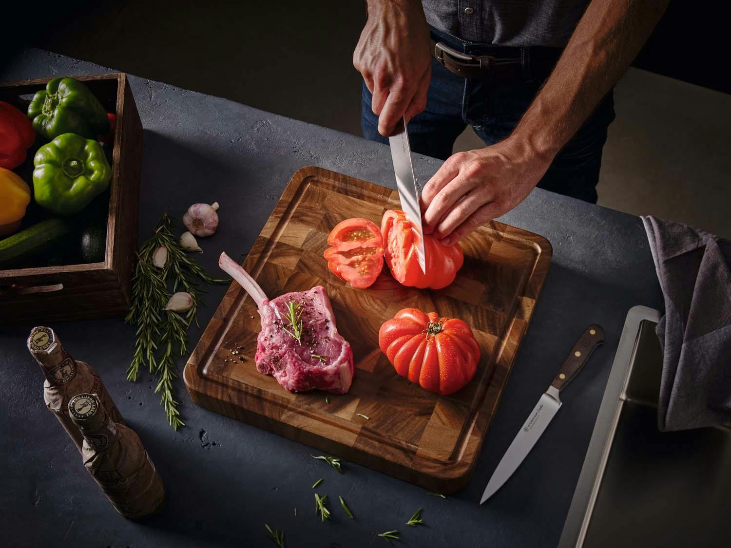 Image of chef slicing a tomatoe with a crafter knife
