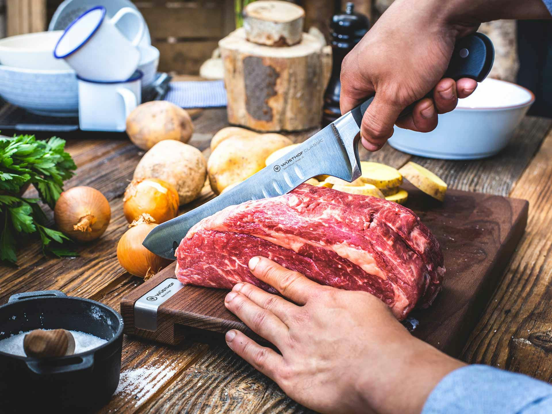 ranch to table image butching a steak