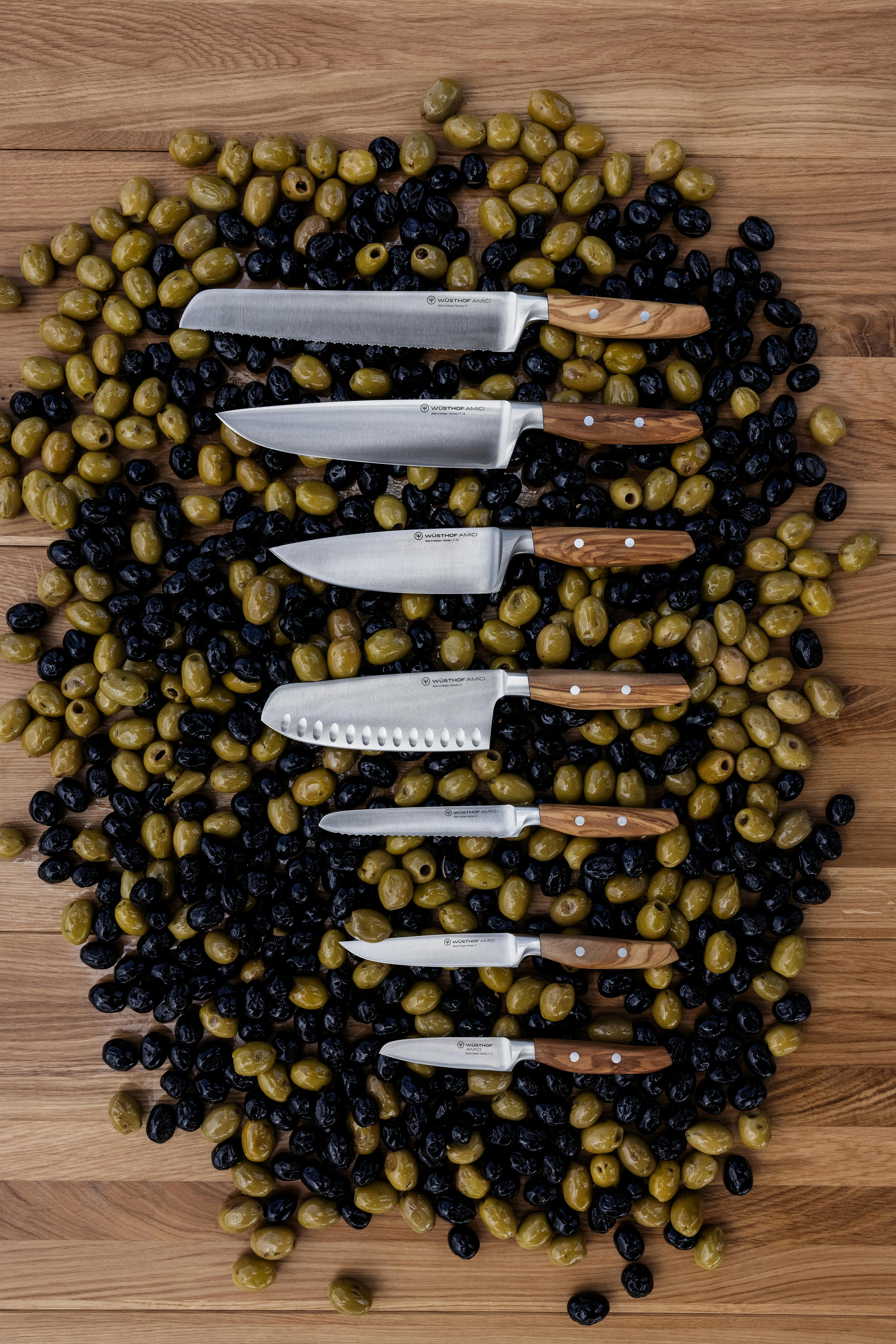 Amici knife lineup on olives