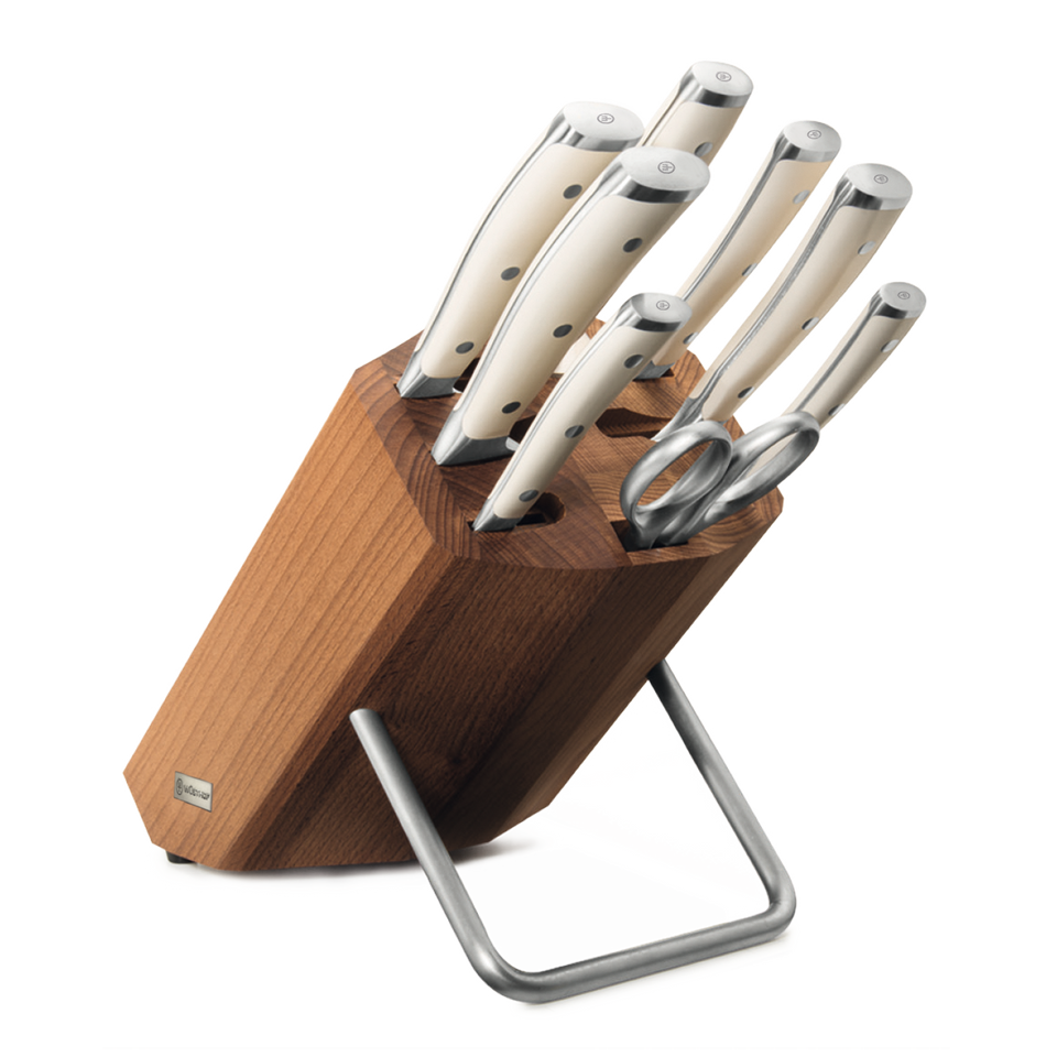 Classic Ikon 9-Piece Knife Block Set featuring ivory handles with polished rivets and a wooden block with stainless steel stand, including chef knives and kitchen shears.
