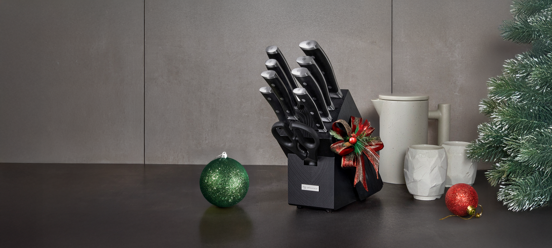 wusthof knife block in black on counter with ornaments