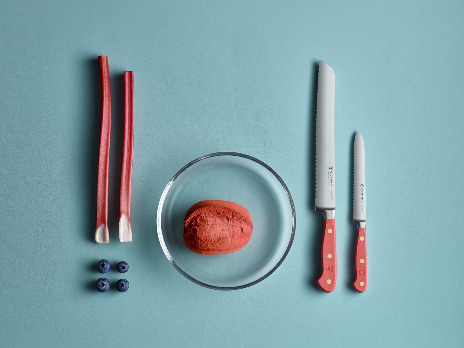 Classic color coral peach knives on teal background